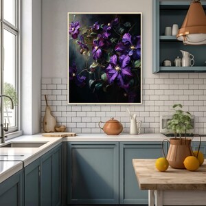 May include: A framed floral art print featuring vibrant purple clematis flowers against a dark background. The artwork is displayed in a kitchen setting with blue cabinets and white tile backsplash.