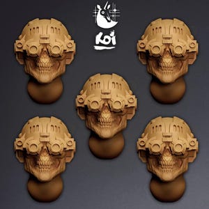 May include: Five tan-coloured, three-dimensional skull heads wearing tactical helmets with mounted night-vision goggles. Each skull features detailed teeth and eye sockets. The logo Koi is positioned at the top centre above the skulls.