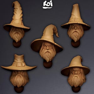 May include: Five tan-colored resin miniature busts of bearded wizards wearing pointed hats with various brim shapes and textures. Each figure features a detailed face with a long beard and mustache. The word Koi is printed in white at the top center.
