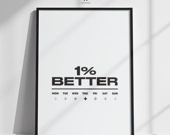 May include: A black framed poster with the words "1% BETTER" in black on a white background. Below the text are the days of the week, with diamond shapes. The poster is leaning against a white wall, with shadows.