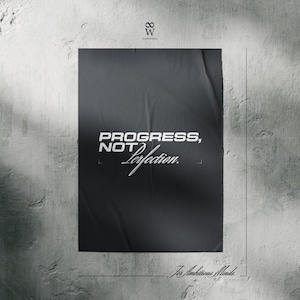 May include: A black poster with the words "PROGRESS, NOT Perfection" in white, with the tagline "For Ambitious Minds." The poster is mounted on a textured gray wall, with shadows.