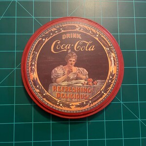 old Coca- Cola tin can