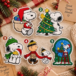 May include: Five embroidered patches featuring Snoopy and Woodstock in holiday scenes. Patch 1 shows Snoopy with a gift sack. Patch 2 shows Snoopy decorating a tree. Patch 3 shows Snoopy hugging Woodstock. Patch 4 shows Charlie Brown and Snoopy walking. Patch 5 shows Snoopy on a ladder.