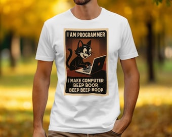May include: White t-shirt featuring a retro-style graphic of a black cat working on a laptop. The text on the shirt reads "I AM PROGRAMMER" and "I MAKE COMPUTER BEEP BOOP, BEEP BEEP BOOP."