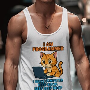 May include: White tank top with the text "I AM PROGRAMMER" above a cartoon orange tabby cat working on a laptop. Below the cat is the text "I MAKE COMPUTER BEEP BOOP, BEEP BEEP BOOP."