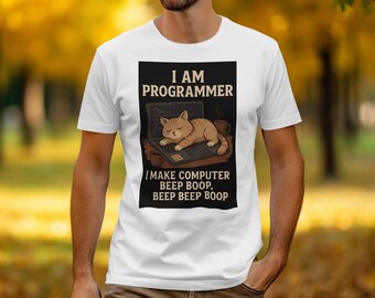 May include: White t-shirt with a black rectangle featuring the text "I AM PROGRAMMER" above an illustration of a cat sleeping on a laptop. Below the cat is the text "I MAKE COMPUTER BEEP BOOP, BEEP BEEP BOOP."