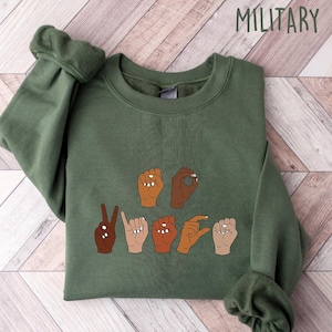 May include: A rustic wooden sign with the text "Welcome to our home" in a handwritten style. The sign features a distressed finish and a simple, inviting design, perfect for entryway decor.