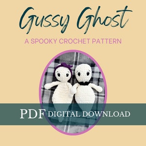 May include: Two crocheted ghost amigurumi toys, one with a purple headband, are lying on a plaid blanket. The text "Gussy Ghost" and "A Spooky Crochet Pattern" are above the toys. The text "PDF Digital Download" is below the toys.