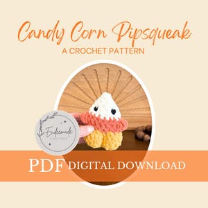 May include: A crochet pattern for a Candy Corn Pipsqueak. The image shows a handmade candy corn toy with white, orange, and yellow yarn. The text "Candy Corn Pipsqueak" and "A Crochet Pattern" are displayed in an orange script font.
