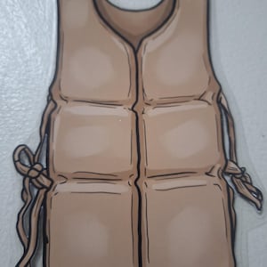 May include: A tan-colored life vest illustration with black outlines and a pink string. The vest has a cartoon-like appearance, featuring a series of rectangular panels and tie closures on the sides. The overall design is simple and clean.