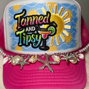 May include: A white ceramic mug with a black handle and the text "But First, Coffee" in a handwritten style. The mug is on a white surface. The mug is approximately 4 inches tall.