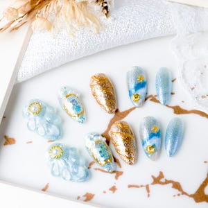 Dreamy Ocean-Themed Press-On Nails, Light Blue Nails with Luxurious Gold Gel Patterns, Y2K Style Press-On Nails with 3D Embellishments