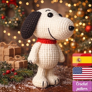May include: A crocheted Snoopy figure, featuring a white body, black ears, and a red scarf. The handmade plushie has black eyes and a smiling face. The image includes a Christmas tree and the text "Crochet pattern".