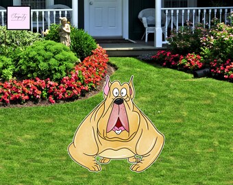 May include: A large, cartoon-style dog yard decoration. The dog is light tan with a pink mouth and ears, and large, surprised eyes. The decoration is placed on a green lawn in front of a house with a white porch and red flowers.