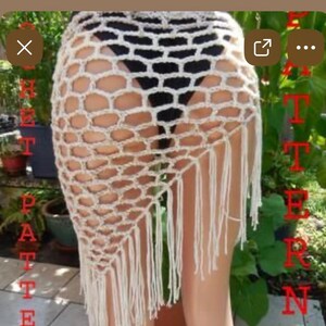 May include: A cream-colored, open-weave crochet skirt with a geometric pattern and fringe along the bottom edge. The skirt is designed to be worn as a beach cover-up or over swimwear. The word "PATTERN" is visible in red text.