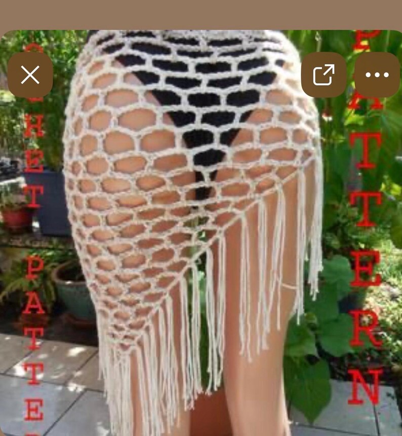 May include: A cream-colored, open-weave crochet skirt with a geometric pattern and fringe along the bottom edge. The skirt is designed to be worn as a beach cover-up or over swimwear. The word "PATTERN" is visible in red text.