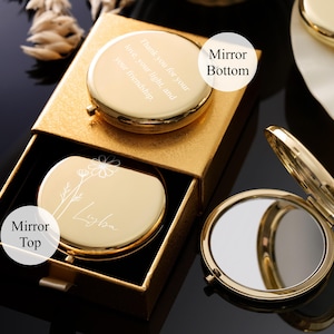 May include: A gold-colored compact mirror with a floral design and the name "Ligba" engraved on the top. The bottom of the mirror has the text "Thank you for your love, your light, and your friendship". The mirror is in a gold box.