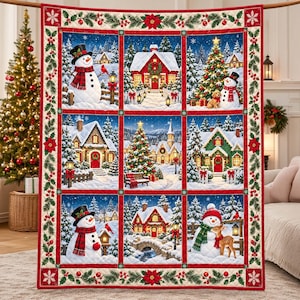 May include: A rectangular quilt featuring a grid of nine winter scenes with snowmen, decorated houses, and Christmas trees. The border is decorated with green pine branches, red berries, and poinsettias on a cream background.