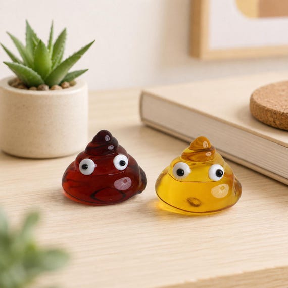 A handmade glass-blown poop emoji figurine — the craft medium (actual glasswork) elevates this way above a plastic gag gift into something weirdly impressive.