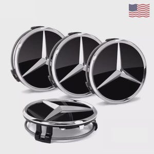 May include: Set of four black and silver Mercedes-Benz wheel center caps. Each cap features the iconic three-pointed star emblem in silver against a black background, surrounded by a silver ring. The caps are new and ready for installation.