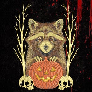 May include: An embroidered design featuring a brown raccoon with wide eyes resting its paws on an orange jack-o'-lantern pumpkin. The scene is flanked by two pale, leafless trees and two beige skulls at the base, all set against a black background.