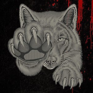 May include: An embroidered design featuring a grey wolf head with two large paws extended forward, showcasing sharp claws. The wolf is rendered in detailed grey thread against a black background with red paint-like splatters on the right side.