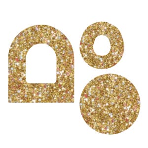 Puede incluir: Tres formas doradas con purpurina: un arco, un círculo con un agujero y un círculo sólido. Las formas tienen un patrón moteado con toques de rosa, blanco y azul. El arco tiene un recorte blanco en el centro.