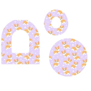 Puede incluir: Tres formas decorativas con un patrón repetido de perros corgi de dibujos animados sobre un fondo lavanda. Las formas incluyen un arco redondeado, un círculo y una forma de rosquilla. Estrellas blancas están dispersas por todo el diseño.