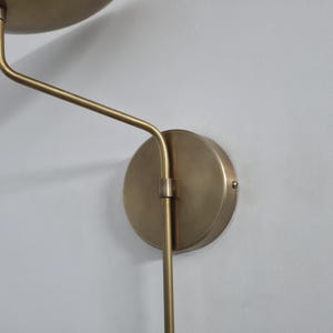 Modern Minimalist Brass Sconce – Uplight Wall Lamp with Pendulum Detail image 2