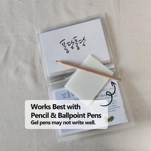 May include: A clear plastic card holder containing white cards with Korean text and a small wooden pencil resting on a translucent white square note. The text on the overlay reads: Works Best with Pencil & Ballpoint Pens. Gel pens may not write well.