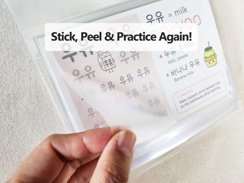 May include: A clear plastic sheet with Korean language practice exercises, featuring the text Stick, Peel & Practice Again!, illustrations of milk cartons, and Korean characters with English translations for milk and banana milk.