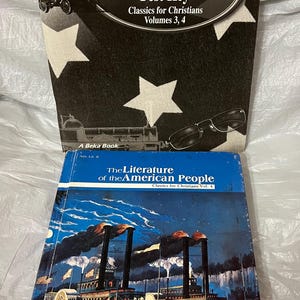 May include: Two textbooks: "American Literature Test Key" with a black cover and white stars, and "The Literature of the American People" featuring a steamboat illustration. Both books are part of the "Classics for Christians" series.