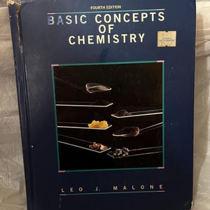 May include: A navy blue textbook titled "Basic Concepts of Chemistry" by Leo J. Malone. The cover features various substances on spoons. The book is a fourth edition and has a sticker on the upper right corner.
