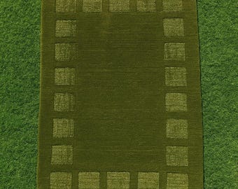 Handwoven Green Wool Rug: Minimalist Geometric Border