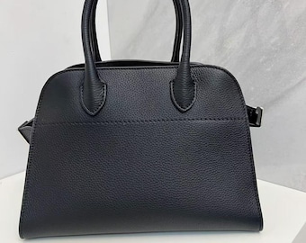 Bolso de viaje clásico de piel de vaca auténtica con textura granulada, elegante