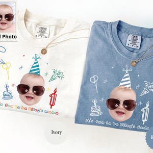 May include: Ivory and blue jean Comfort Colors t-shirts with a baby face wearing sunglasses and a party hat. The shirts have the text "It's fun to be Riley's mama" and "It's fun to be Riley's dada".