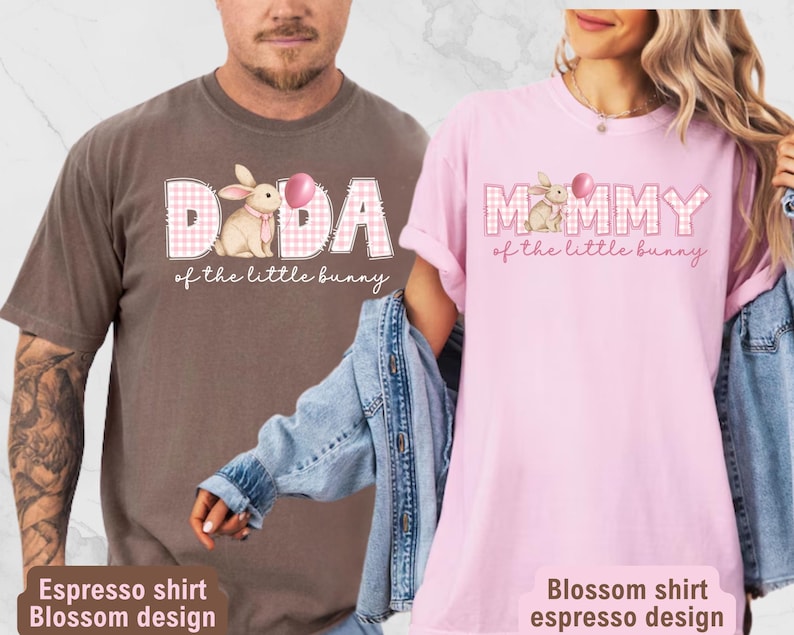 May include: Two t-shirts, one espresso and one blossom pink, feature the text "DADA" and "MOMMY" with a bunny graphic and the phrase "of the little bunny." The shirts have a relaxed fit and are perfect for Easter.