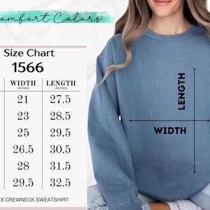 May include: A light blue unisex crewneck sweatshirt. The image includes a size chart with measurements in inches for width and length, ranging from size S to 3XL. The text "Comfort Colors" is at the top.