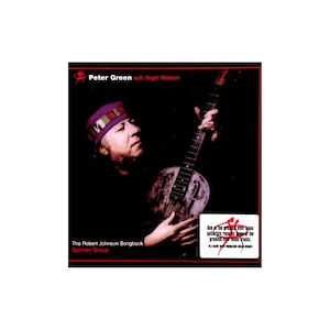 May include: A music album cover featuring Peter Green with Nigel Watson, titled The Robert Johnson Songbook by Splinter Group. The image shows a person wearing a patterned headband, playing a resonator guitar against a black background.