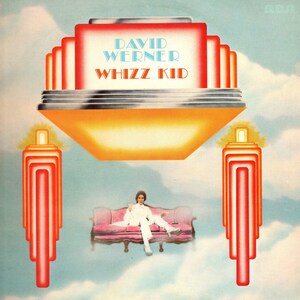 May include: Album cover for "Whizz Kid" by David Werner. The artwork features a retro design with a large orange and red structure at the top, and a person in white sitting on a pink couch. The sky is a light blue with clouds.