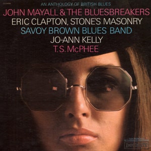 May include: Album cover for "An Anthology of British Blues" featuring John Mayall & The Bluesbreakers, Eric Clapton, and others. The image shows a woman wearing octagonal sunglasses with a British flag design. The album title and artist names are in pink and blue.