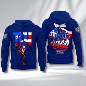 May include: Two blue hoodies with a design featuring the Puerto Rican flag and the words "Puerto Rico Giants". One hoodie displays a frog with the flag's colors and the letters "NYU". The other hoodie has the words "Puerto Rico" in a graffiti style.