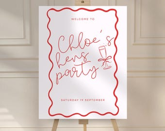 Könnte beinhalten: Ein weißes Schild auf einer Staffelei mit rotem Text und rotem Wellenrand. Auf dem Schild steht "Willkommen bei Chloes Junggesellinnenabschied" mit einer Champagnerglas-Illustration und "Samstag, 19. September".
