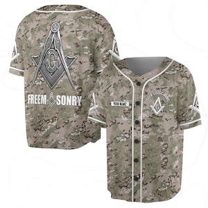 May include: A camouflage baseball jersey with white trim and buttons. The jersey features Masonic symbols and the words "FREEM SONRY" on the back. The front has space for a name and lodge name. The design incorporates a mix of green, brown, and tan.