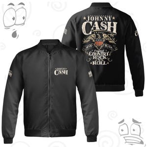 May include: Black bomber jacket featuring the name "JOHNNY CASH" in white lettering on the front and back. The back of the jacket displays a vintage-style graphic with an eagle, the words "MAN IN BLACK", and "Original Country Rock & Roll".