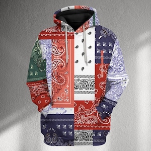 May include: A patchwork hoodie with a variety of paisley patterns in red, white, blue, and green. The hoodie has a drawstring hood and a black interior. The design is a mix of different bandana styles.