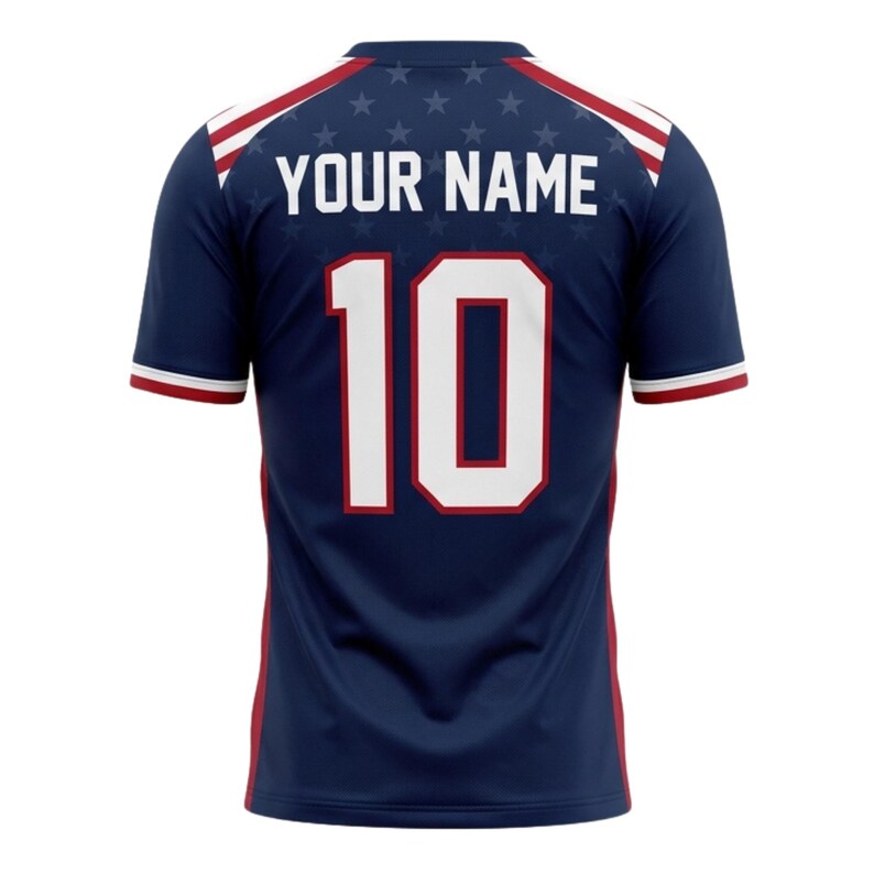 May include: Navy blue athletic jersey with white and red accents. The back features the number 10 in white with a red outline, and the text "YOUR NAME" above. A pattern of small white stars is visible.
