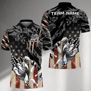 May include: Bowling polo shirt with a patriotic design. The shirt features an American flag motif, bowling pins, and a claw graphic. The text "YOUR NAME" and "TEAM NAME" are visible on the shirt.