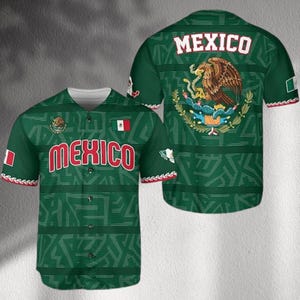May include: Green baseball jersey with the word "MEXICO" in red block letters on the front and back. The back features the Mexican coat of arms and the word "MEXICO" in white. The jersey has a white collar and red and white trim.