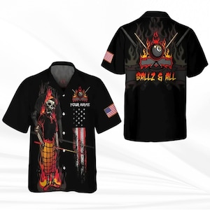 May include: Black short-sleeved button-down shirt with a skull graphic holding a pool cue, flames, and an American flag design. The back of the shirt features a pool ball and the text "BALLZ & ALL". Includes space for "YOUR NAME".